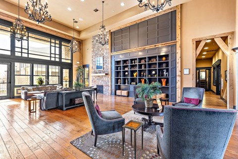 a large living room with furniture and a bookshelf